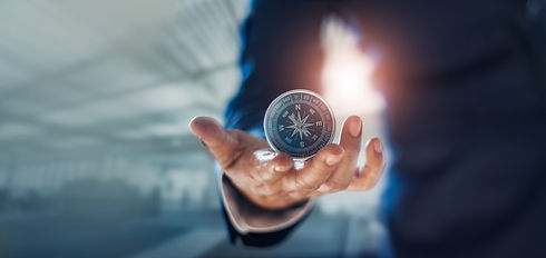 Businessman hand holding compass navigat