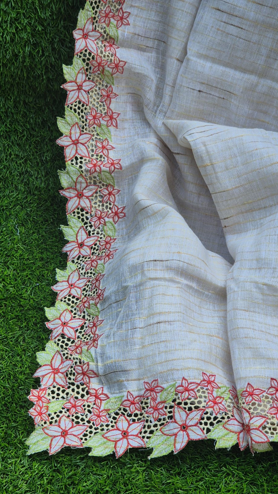 Linen cutwork saree with floral embroidery border and elegant off-white tone