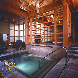 Inside Salish spa building; whirlpool and rustic lodge decor