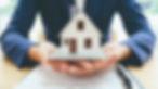 hands holding house for dscr loans investor loan source