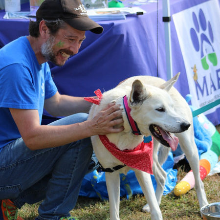 MARS Community Relations Manager Joe with rescue dog at BarkBQ community event