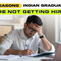 Man in white shirt, looking frustrated, writes in notebook at desk with laptop. Text reads: "5 reasons Indian graduates are not getting hired".
