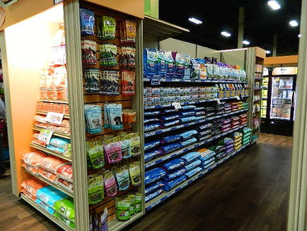 Pet Store retail fixtures and displays. Custom themed displays for pet stores. Custom made fixture for pet store. Pet store design and merchandising tips. Ultimate pet store, best pet store fixtures. Custom bone display tables. Display tables for pet products. Custom cabinets, shelving, fixtures and tables for pet store.