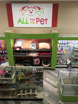 Pet Store retail fixtures and displays. Custom themed displays for pet stores. Custom made fixture for pet store. Pet store design and merchandising tips. Ultimate pet store, best pet store fixtures. Custom bone display tables. Display tables for pet products. Custom cabinets, shelving, fixtures and tables for pet store.