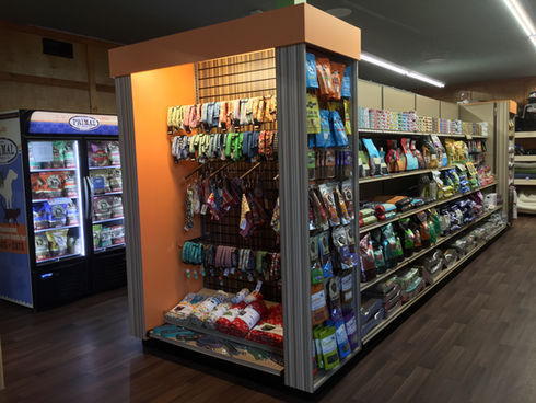 Pet Store retail fixtures and displays. Custom themed displays for pet stores. Custom made fixture for pet store. Pet store design and merchandising tips. Ultimate pet store, best pet store fixtures. Custom bone display tables. Display tables for pet products. Custom cabinets, shelving, fixtures and tables for pet store.