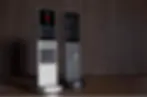 Two sleek home automation remotes with touchscreens