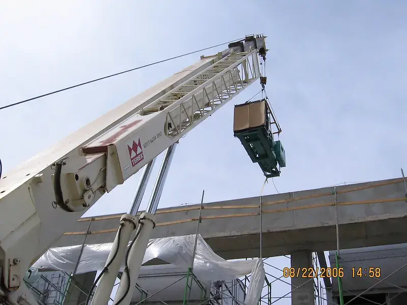 Crane installing generator in Cayman