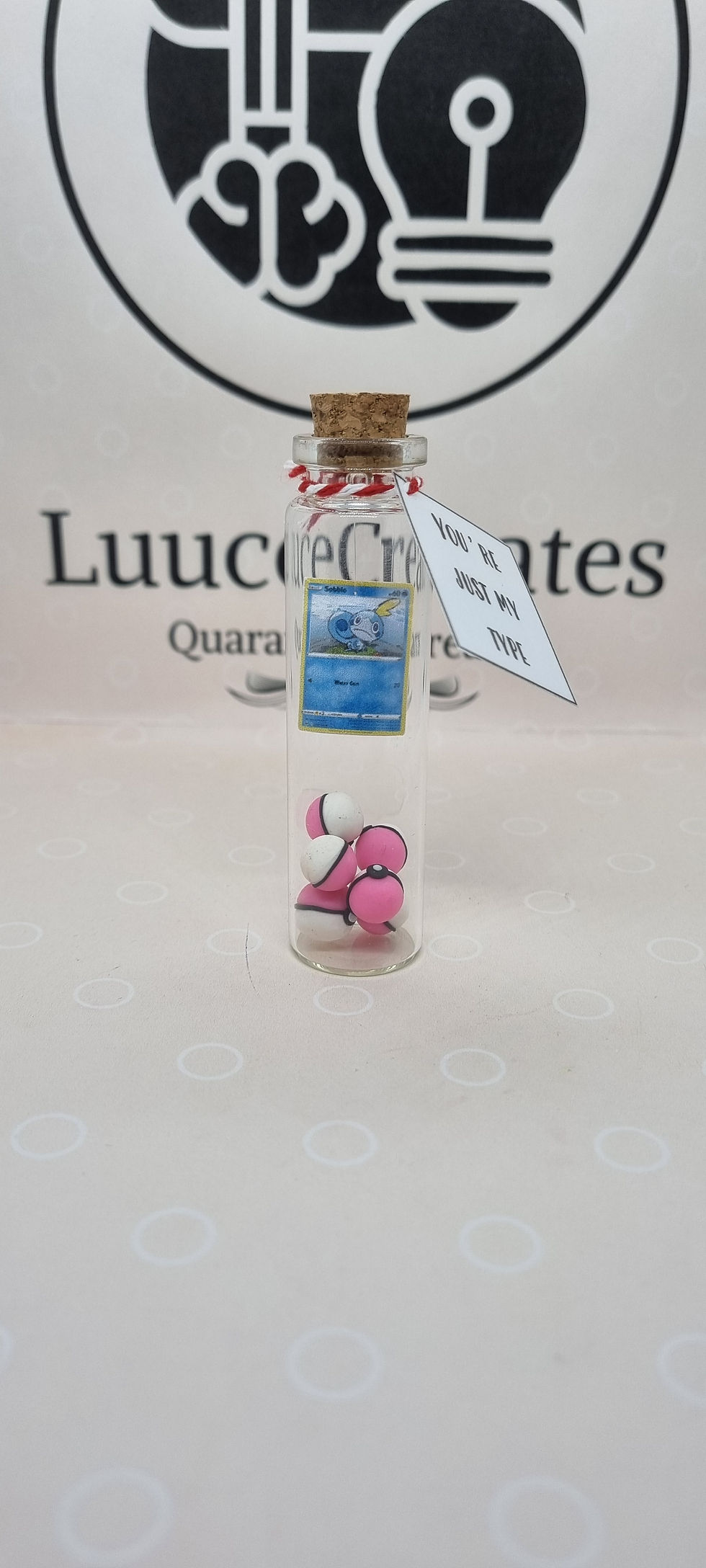 Thumbnail: Mini Pokemon Card with Pink Pokeballs Bottle