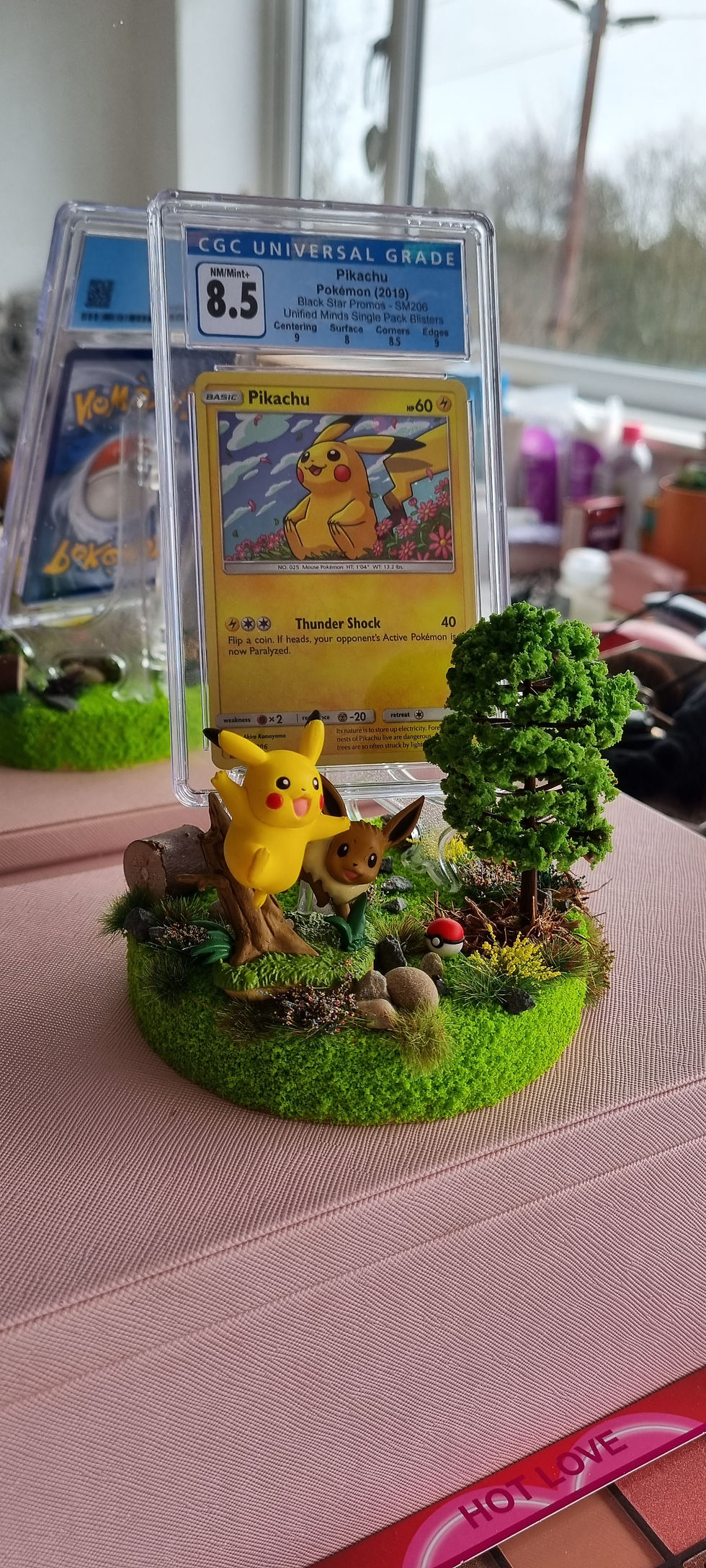 Thumbnail: Pikachu and Eevee Pokemon Card Display Graded Card Stand