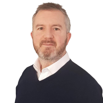 Portrait of a man with a beard in a navy sweater.
