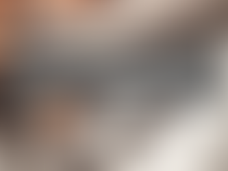 Person in workout gear sits on floor with dumbbells and headphones nearby. Text overlay: "How Often Should You Take Rest Days?"