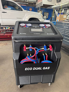 Dual refrigerant A/C machine for R-1234yf and R-134a service at G-Man Automotive in Houston