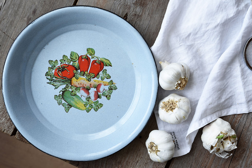 Vintage enamel platter for serving bread, fruit, pastries, or seasonal harvests.