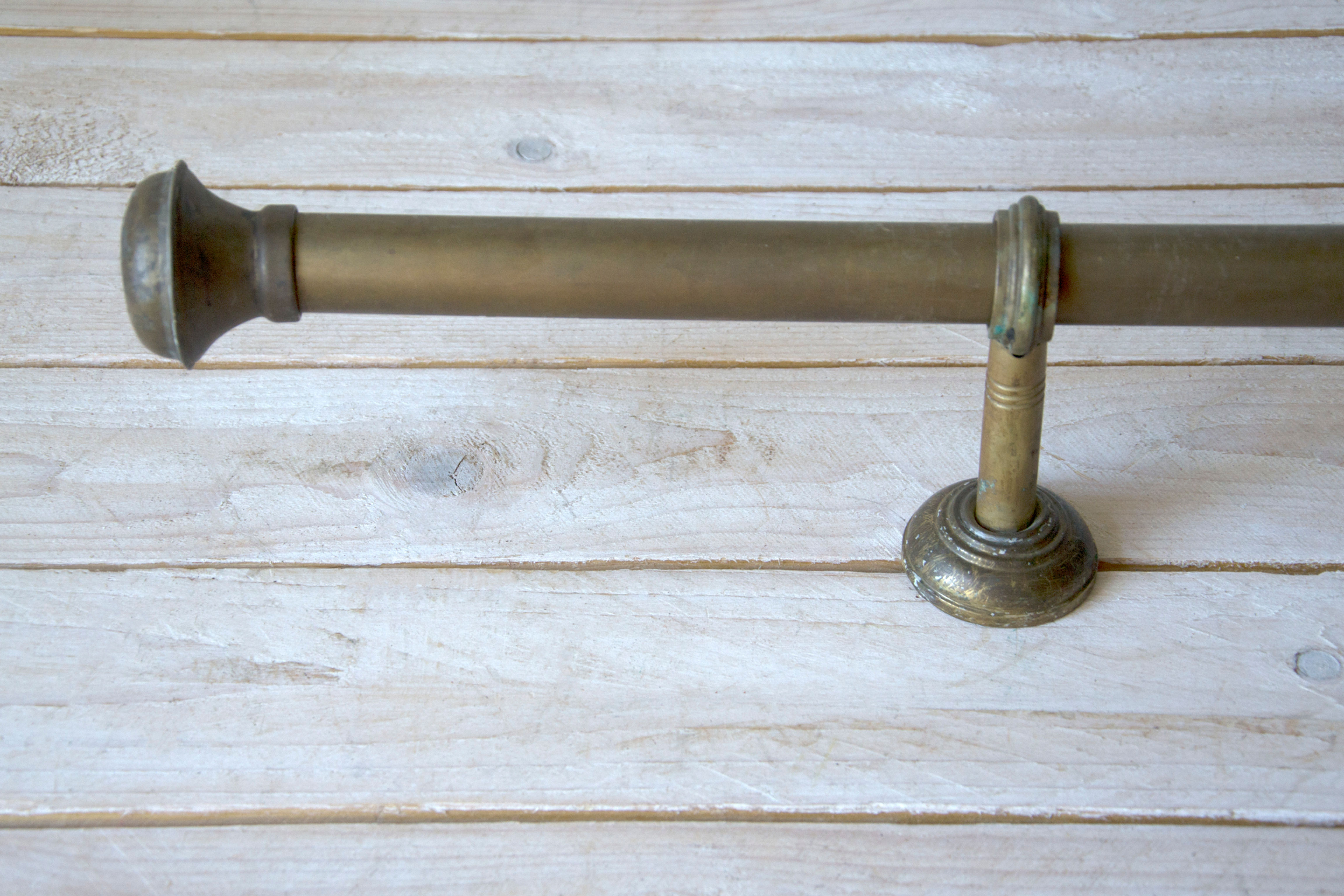 Restored vintage curtain rod with decorative ends – ideal for period interiors