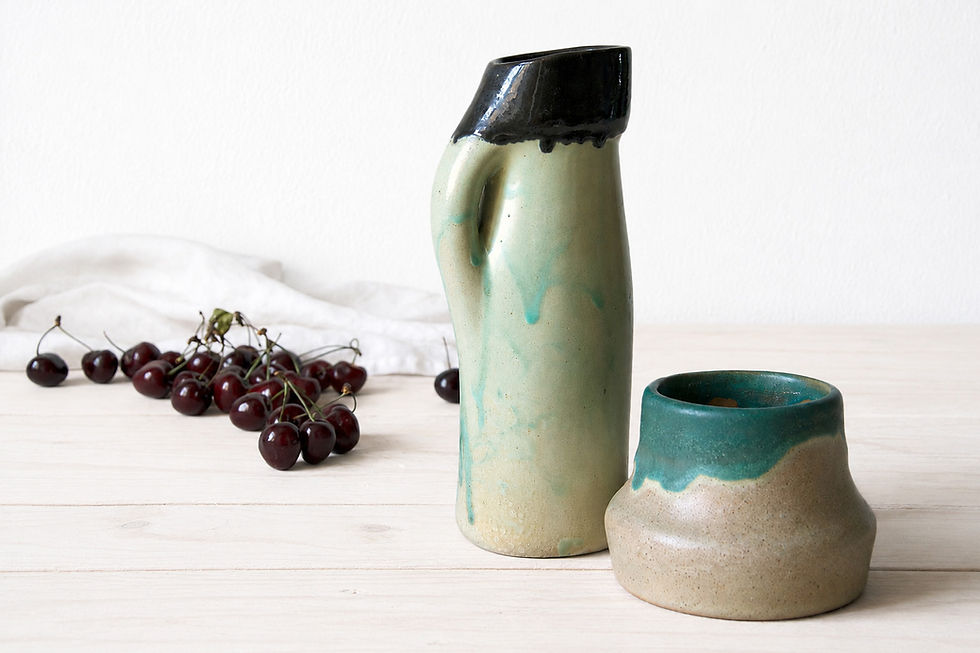 Rustic ceramic vase with organic handmade form and natural stoneware texture