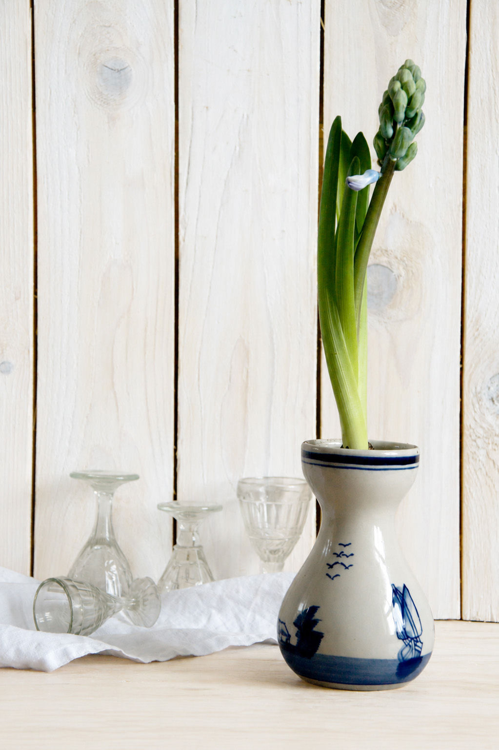Vintage Delft style bud vase with blue windmill landscape and bulb flower display