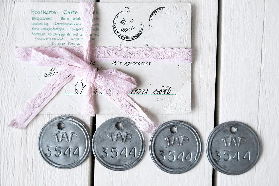 Four round vintage metal tags embossed TAP 3544, displayed together to show the matching markings and small hanging holes