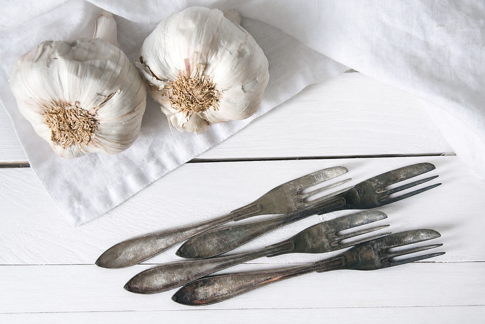 Vintage dessert forks and knives with authentic patina for farmhouse table settings.