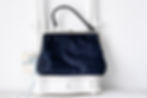 Mid century blue purse with structured shape and top clasp closure