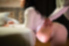 cropped-image-kneeling-pregnant-woman-midwife-home-woman-casual-clothes-leaning-bed-asian-