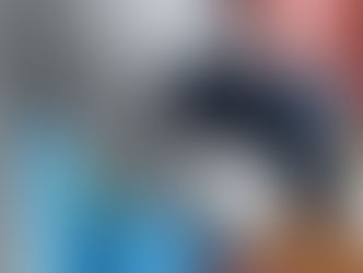 Hand steamer removing wrinkles from sleeve of grey dress shirt