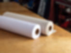 Two rolls of interfacing on professional sewing workroom table