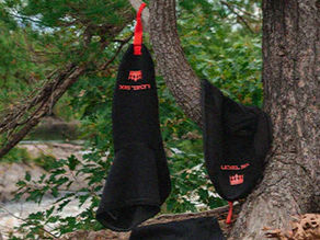 Sprayskirts hanging from a tree