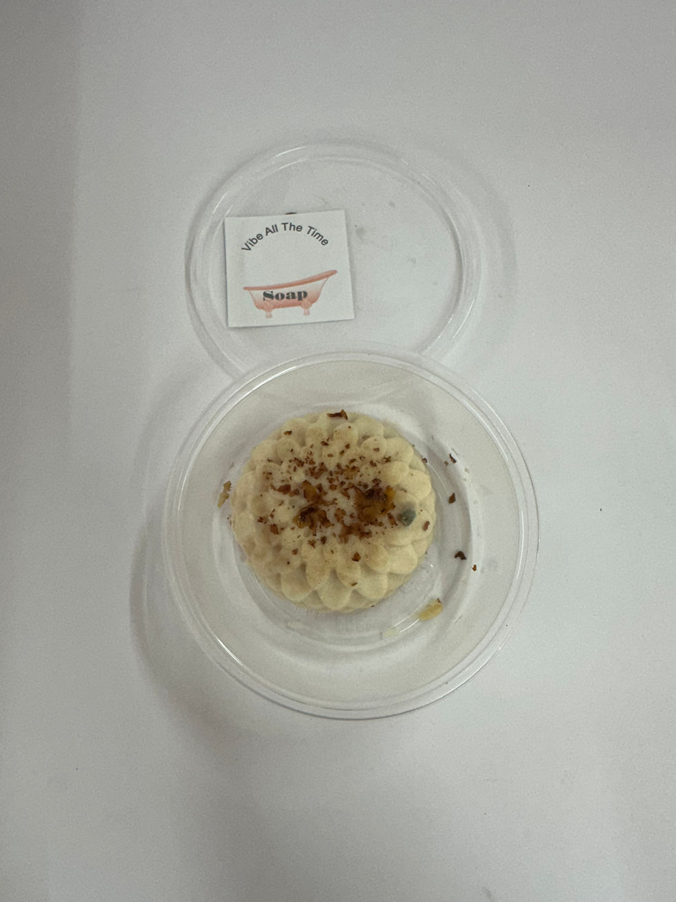 Product in clear container with text: 
