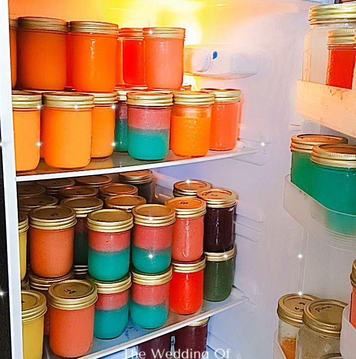 Miniatura: Colorful jars inside a refrigerator. Sea Moss Me Now products, including various flavors and colors