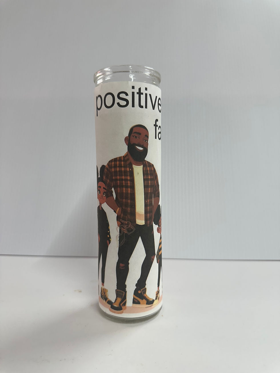 Positive Family Energy 7-Day Prayer Candle, with a Black man, and text.