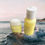 Thumbnail: Two yellow skincare products sitting on a rock near the ocean Sea Moss Me Now