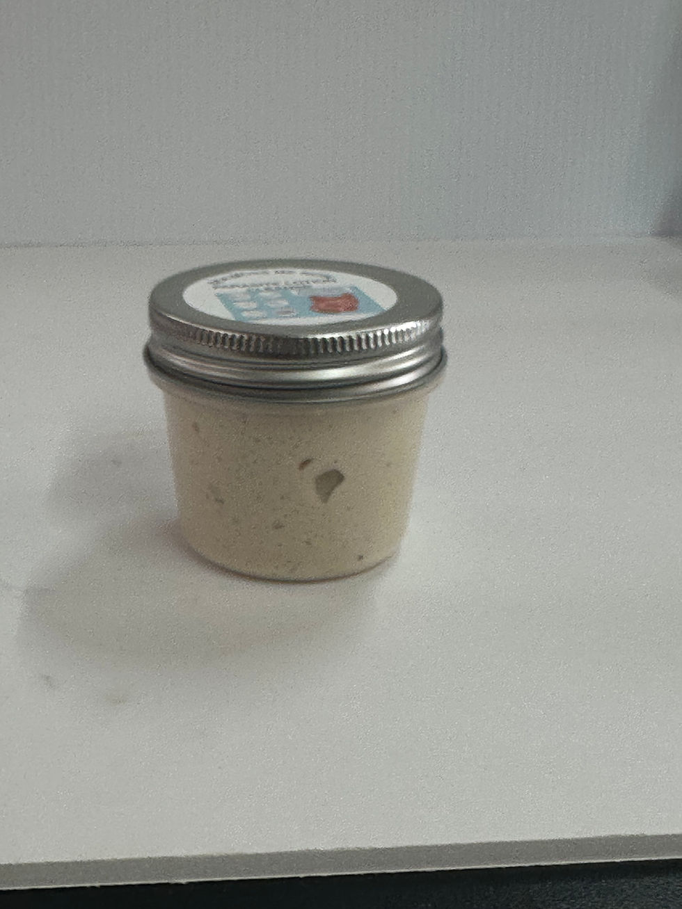 Small jar with label and contents, product shot on white background, Sea Moss Me Now