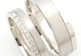 Image of His and Hers matching wedding bands in Platinum with diamond accents