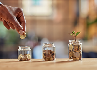 Close up of black woman hand adding money in coin in a jar Girl hand holding coin adding m
