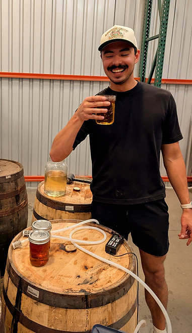Spinnaker Distillery - Kevin McBrayer with barrels of rum