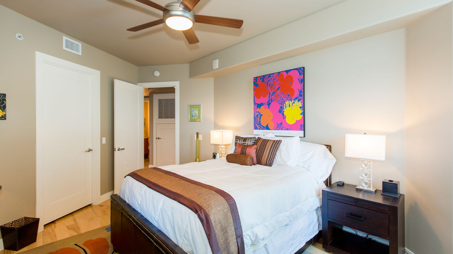 A comfortable and stylish bedroom makes a great example of Interior Photography for Real Estate.