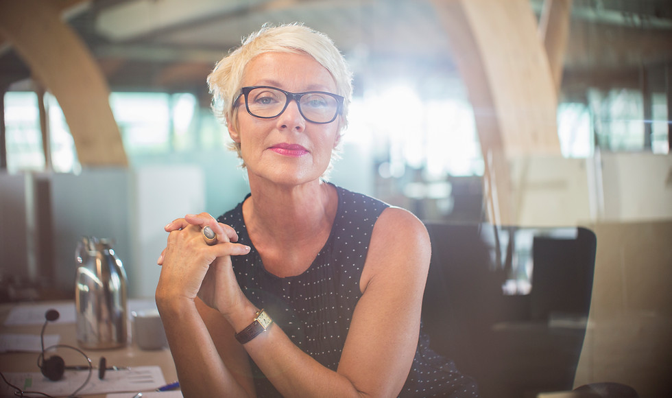 a specialist diversity consultant wearing glasses and a black spotted top