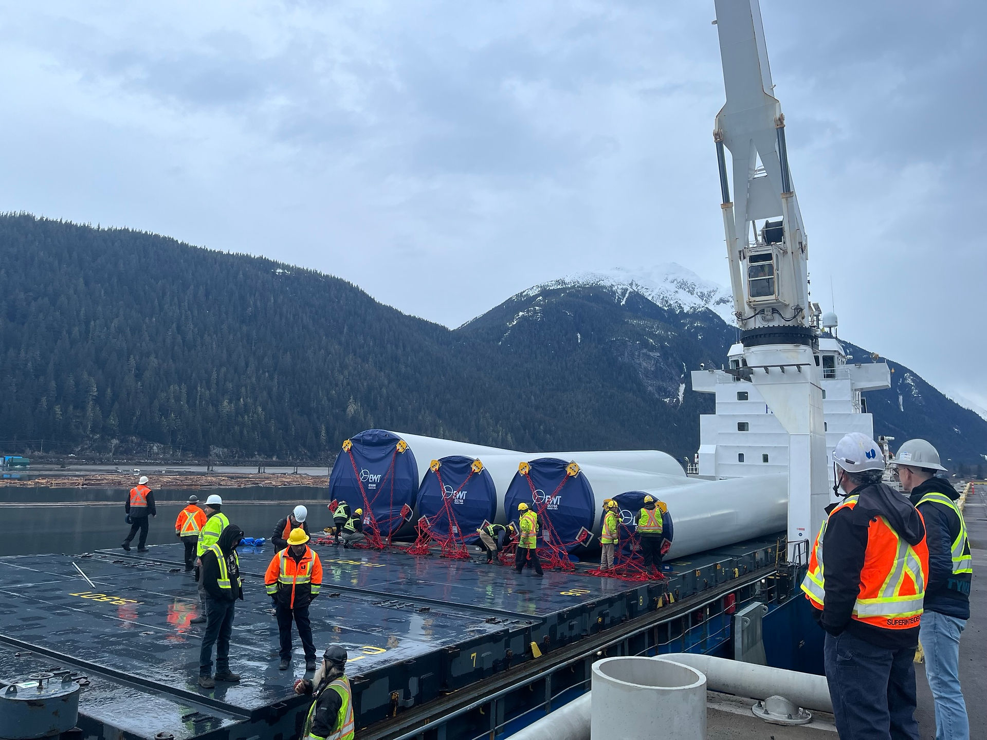 Crews unload turbine towers