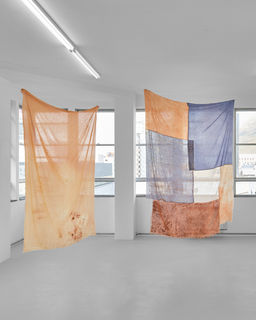 Yonela Makoba
inimba (left)
2025
Cotton, dyed with clay from district 6 and imbola (red ochre)

Uthini umoya? (Right)
2025
Cotton, voile, wax dyed with clay from district 6, indigo dye and imbola (red ochre)

RESERVOIR
Reservoir Projects