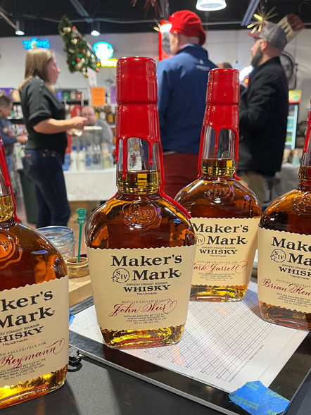 Calligraphy on four Maker's Mark bottles done on-site by Emily Rose Cooper for a holiday brand activation event