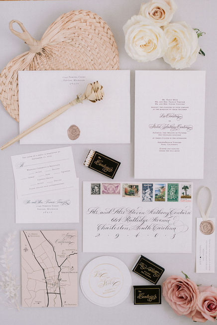 classic flourished copperplate calligraphy wedding invitation envelope addressing with custom vintage postage stamp set