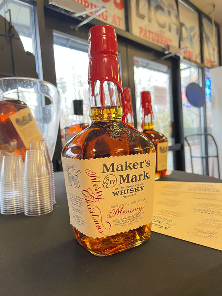 Calligraphy on a Maker's Mark bottle done on-site by Emily Rose Cooper