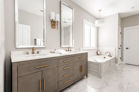 beautiful grey and gold bathroom with bathtub