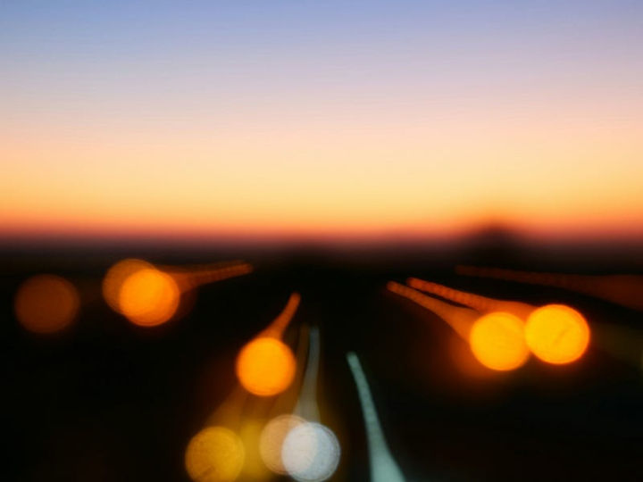Blurred city lights at dusk representing AI Hallucination—when AI-generated content looks real but may be incorrect. Relevant to AI in Business, Digital Transformation, and Enhancing Customer Experience.