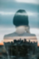 Silhouette of a person blended with a cityscape, representing how AI in business applications and digital transformation strategies are driving growth in the creator economy.