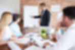 Group of people attending a business presentation