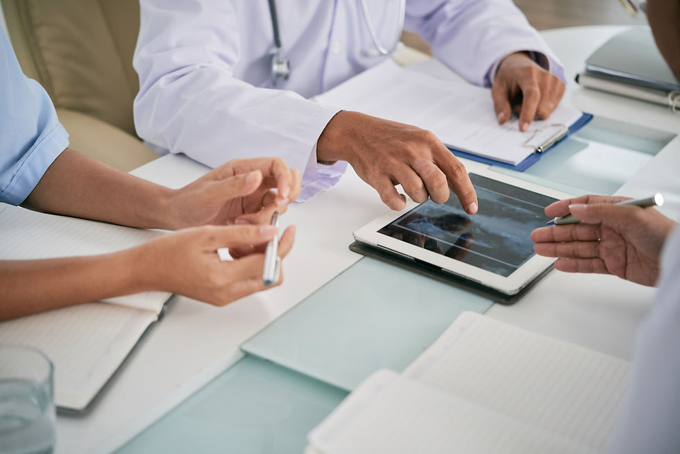 Healthcare professionals reviewing patient records and clinical documentation