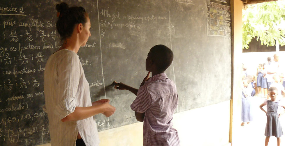 volunteer teaching children in Togo