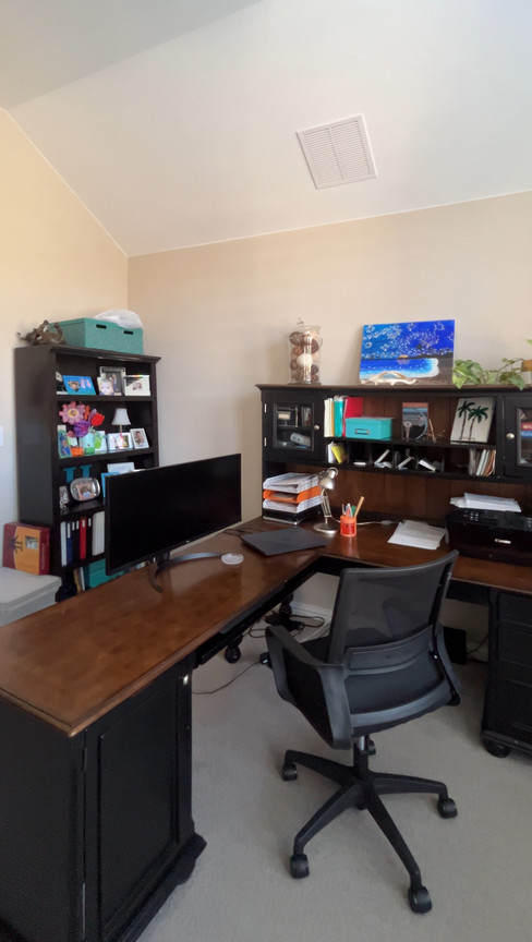 Before and after of a home office transformed with custom built-in cabinets, LED lighting, and moody blue arches by Prohl Design.