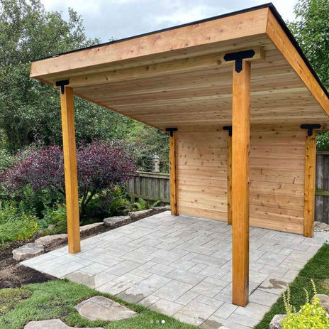 Backyard living design project in Burlington Ontario with patio, pergola, landscaping, and seating area